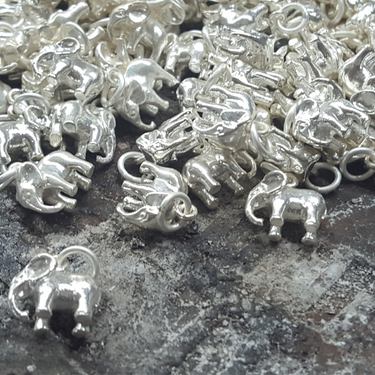 Elephant charms made with recycled silver