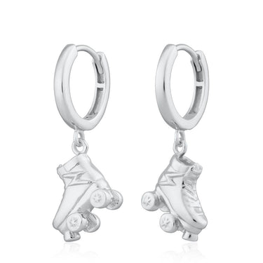 Silver hoop earrings with roller skate charms on a white background