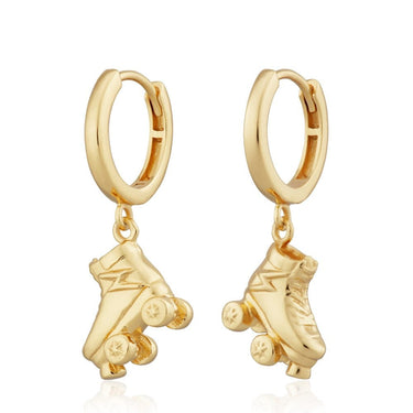 Gold hoop earrings with roller skate charms on a white background