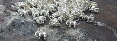 Elephant charms made with recycled silver