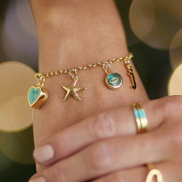 Gold Starfish Charm on Charm Bracelet