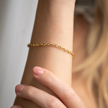 Gold Charm Bracelet on Wrist