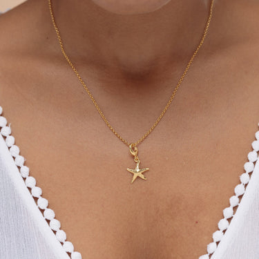 Woman Wearing Gold Starfish Charm  Necklace | Sea-themed Pendant Necklace
