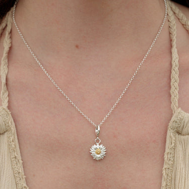 Woman Wearing Silver Daisy Charm Necklace | Flower Pendant Necklace