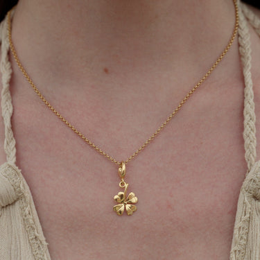 Woman Wearing Gold Four Leaf Clover Charm Necklace | Good Luck Pendant