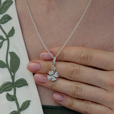 Woman Wearing Silver Four Leaf Clover Charm Necklace | Good Luck Pendant