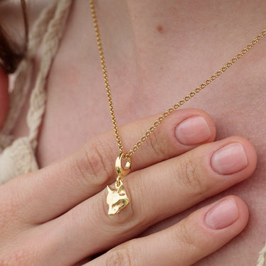 Gold Fox Charm Necklace held in hands | Animal Pendant Necklace