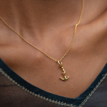 Woman Wearing Gold Anchor Charm Necklace | Nautical Pendant Necklace