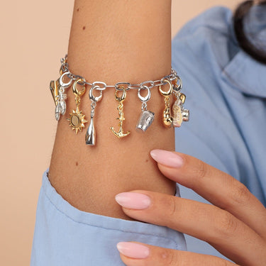 gold anchor on travel themed charm bracelet