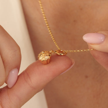 Gold Cupcake Charm Necklace Held in Hands
