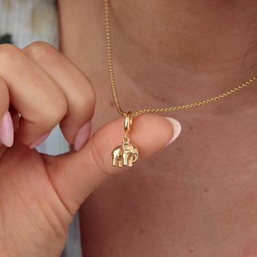 Woman Wearing Gold Elephant Charm Necklace | Animal Pendant Necklace