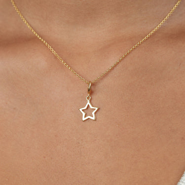 Woman Wearing Gold Open Star Charm  Necklace | Celestial Pendant Necklace