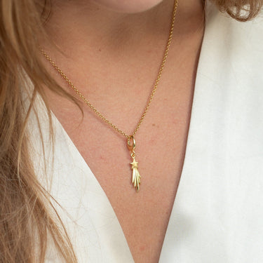 Woman Wearing Gold Shooting Star Charm Necklace | Star Pendant Necklace