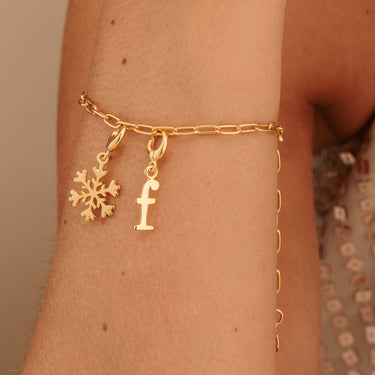 Gold Snowflake Charm on Charm Bracelet with Letter F Charm