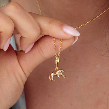 Woman Holding Gold Tiger Charm Necklace | Animal Pendant Necklace