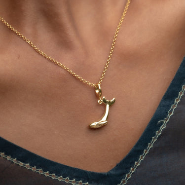 Woman Wearing Gold Whale Charm Necklace | Whale Pendant