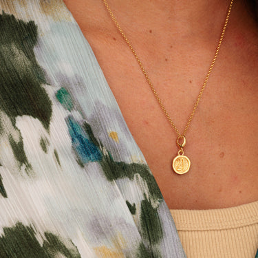 Woman Wearing Gold 21st Birthday Charm Necklace | Gold Number 21 Pendant