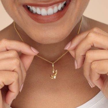 Woman Holding a Gold Origami Fox Charm Necklace | Fox Pendant Necklace