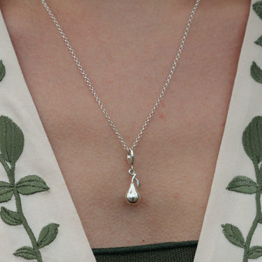 Woman Wearing Silver Pear Charm Necklace | Fruit Pendant Necklace