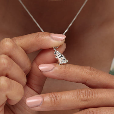 Woman Holding Silver Pug Charm Necklace | Dog Pendant Necklace