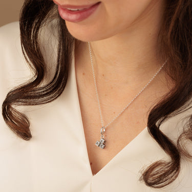 Woman Wearing Silver ABC Building Block Pendant Necklace | Baby Block Charm Necklace