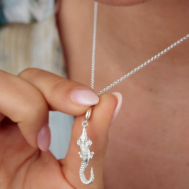 Woman Holding Silver Crocodile Charm Necklace  | Alligator Pendant Necklace