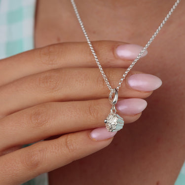 Woman Holding Silver Cupcake Charm Necklace | Cake Pendant Necklace