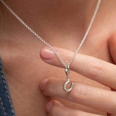Woman Wearing Silver Lucky Horseshoe Charm Necklace | Good Luck Pendant