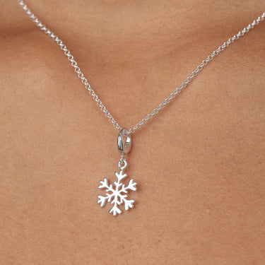 Woman Wearing Silver Snowflake Charm Necklace | Christmas & Winter Pendant Necklace