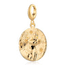 An engravable gold Taurus zodiac charm featuring a bull with stars around it, crafted from recycled 925 sterling silver.