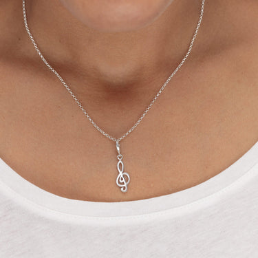 Woman Wearing Silver Treble Clef Charm Necklace | Music Note Pendant Necklace