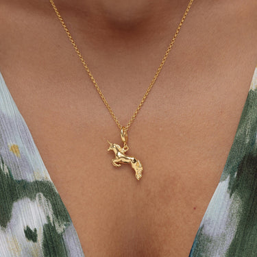 Woman Wearing Gold Unicorn Charm Necklace | Unicorn Pendant