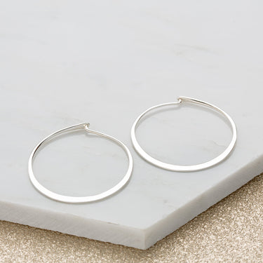 Silver Flat hoops by Lily Charmed